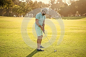 sportive man playing golf game on green grass, sport game