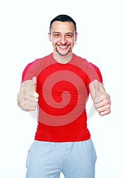 Sportive man thumbing up in red T-shirt