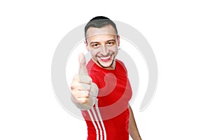 Sportive man thumbing up in red T-shirt