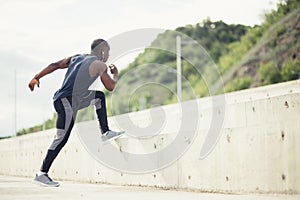 Sportive man training outdoors - Runner jogging, lifestyle and sport concept