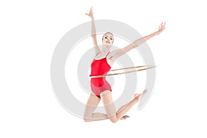 Sportive rhythmic gymnast training with hoop on waist