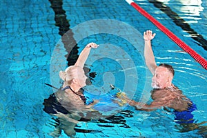 Sportive senior couple doing exercises