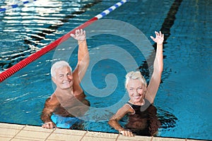 Sportive senior couple doing exercises