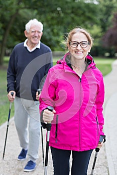Sportive senior man and woman photo