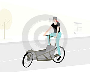 Sportive woman riding empty cargo bicycle on city road. Bakfiets composition. photo