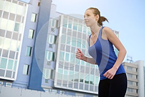 Sportive woman running outdoor