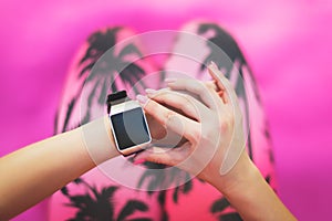 Sportive Woman After Workout Session Checking Fitness Results on Smart Watch. Young woman checking fitness progress