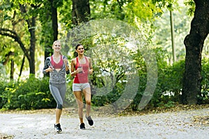 Sportive women jogging in park