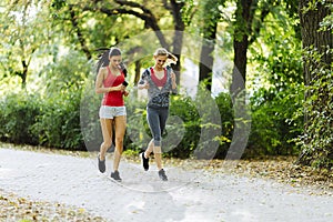 Sportive women jogging in park