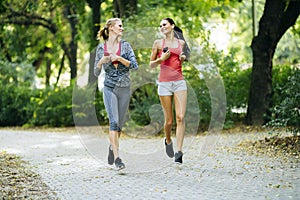 Sportive women jogging in park