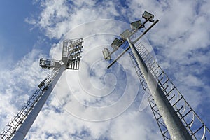 Sportlight of football stadium with blue sky