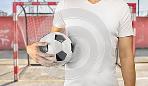 Sportman holding a soccer ball