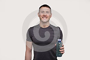 Sportman Holding Sport Drink. Energy Drink for Sport. Man with Drink in Hands.