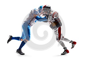 Sports action. Fight of two American football players. Sports emotions. Isolated on white background