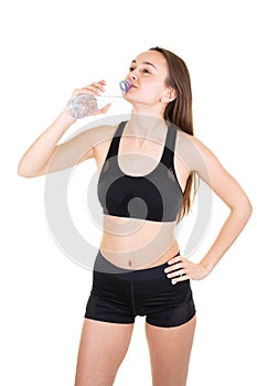 Sports active lifestyle woman hydrating with water sports bottle