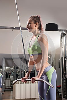 Sports background. Muscular fit woman exercising.