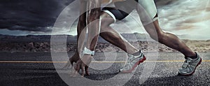 Sports background. Runner feet running on road closeup on shoe.