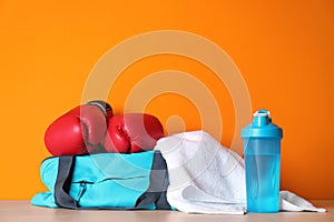 Sports bag, boxing gloves, towel and bottle