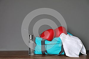 Sports bag, boxing gloves, towel and bottle