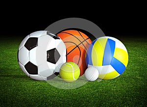 Sports balls on grass