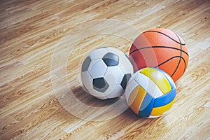 Sports balls on parquet in sports hall 3D