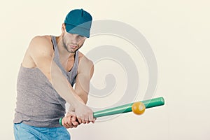 Sports and baseball training concept. Guy in grey tank top