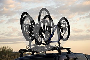 Sports bicycle over jeep