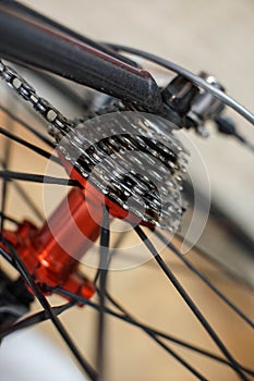 Sports bicycle red rear axle with racing cassette gears