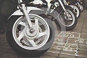 A sports bike is standing on the ground close up