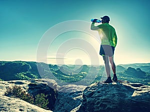 Sports bottle drink sport man drinking water on trail run