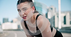 Sports, breathing and face of woman in the city for race, marathon or competition training. Fitness, rest and portrait