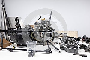 Sports car engine parts on the table. Assembling of vehicle engine. Car engine parts. Assembly of modern powerful car engine