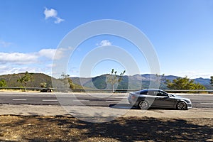 Sports Car Parked in a Mountain Road