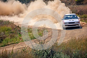 Sports Car on the Turn of the Rally Track and a Lot of Dust 01
