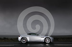 Sports car under stormy sky