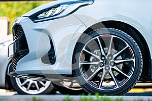 Sports car wheels, low profile tires on aluminum rims, closeup