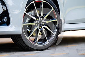 Sports car wheels, low profile tires on aluminum rims, closeup