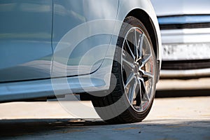 Sports car wheels, low profile tires on aluminum rims, closeup