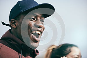 Sports, cheer and excited black man in stadium shouting, cheering and screaming support for team. Motivation, success