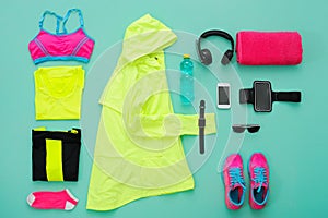 Sports clothing and accessories on turquoise background.