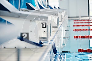 Sports, competition and podium row by swimming pool for training, exercise and workout for water sport. Fitness mockup