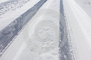 Sports cross country skiing loipe in fresh snow on a road