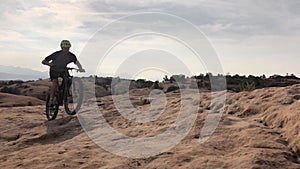 Sports, desert and man on mountain bike ride for fitness, exercise or outdoor trip for cardio practice. Bicycle, motion