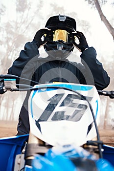 Sports, dirt bike and speed with person on motorcycle in forest for challenge, training and performance. Fast, fitness