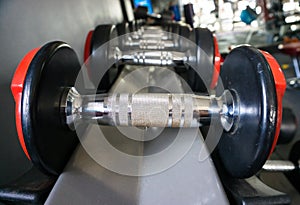 Sports dumbbells in modern sports club. Weight Training Equipment .