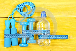 Sports equipment in cyan blue color. Gym and workout concept