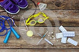 Sports equipment racket, skipping rope, swimming goggles, sneakers, sports medal and medicines