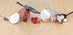 Sports equipment, rackets and balls on hardwood court floor. Horizontal education and sport poster, greeting cards, headers, websi