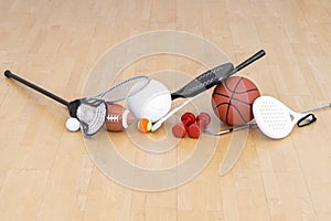 Sports equipment, rackets and balls on hardwood court floor. Horizontal education and sport poster, greeting cards, headers, websi