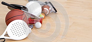 Sports equipment, rackets and balls on hardwood court floor. Horizontal education and sport poster, greeting cards, headers, websi